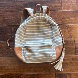 gray/white striped jersey knit backpack with faux leather bottom and zippers